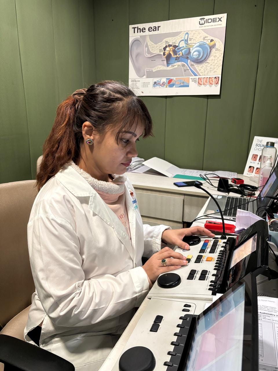 Audiologist performing a hearing test in Gurgaon